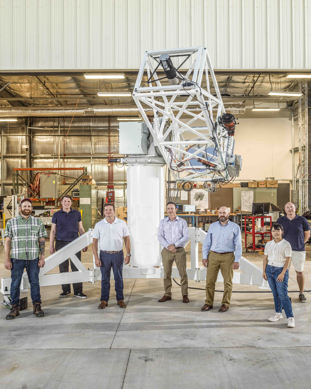 LFAST team members standing in front of the 1X test telescope.