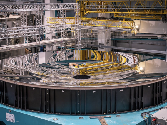 The finished mirror for the Vera C. Rubin Observatory's telescope after arriving on site in Chile. Fabricated by the University of Arizona Richard F. Caris Mirror Lab, the mirror spans 27 feet in diameter and acts both as the observatory's primary and tertiary light-collecting surface in one piece, a groundbreaking design approach.