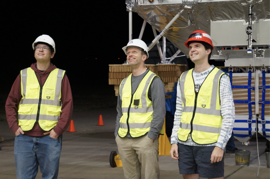 UArizona members waiting during one of nine launch attempts. Left to right: Dr. Ian Lowe, Dr. Dan Marrone, Evan Mayer. PC: Susie Zukosky (UIUC)