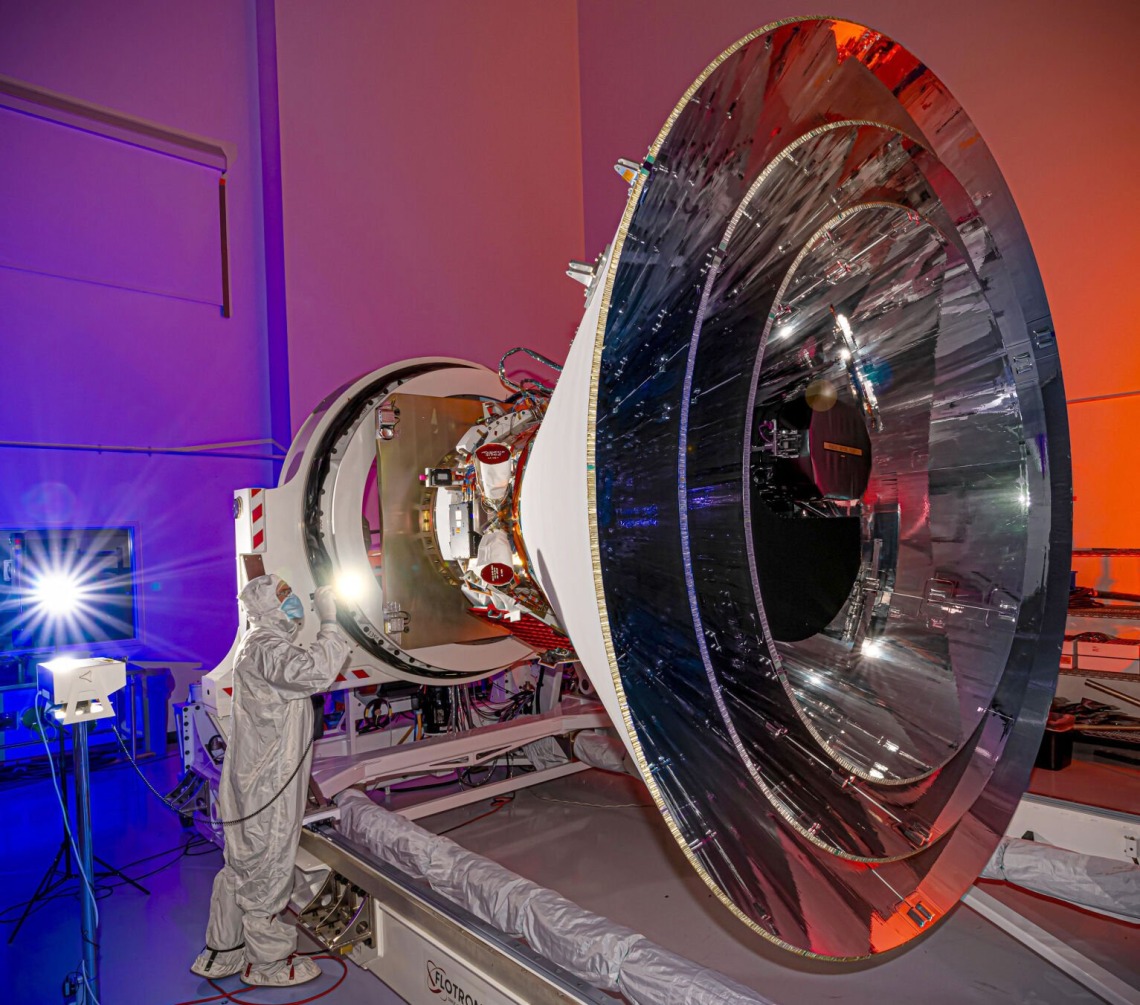 NASA’s SPHEREx observatory is oriented in a horizontal position, revealing all three layers of photon shields as well as the telescope. This photo was taken at BAE Systems in Boulder, Colorado, in April 2024. NASA/JPL-Caltech/BAE Systems