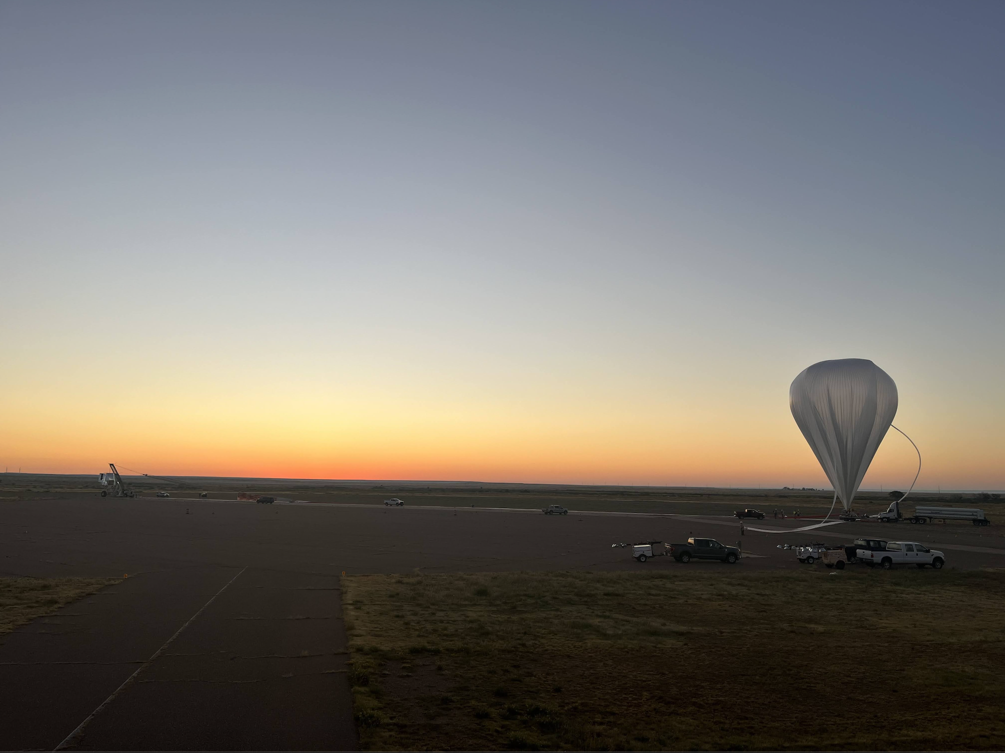 TIM gondola and balloon on launch pad during inflation. When the balloon is laid out and being inflated, there's no turning back! PC: Joaquin Vieira (UIUC)